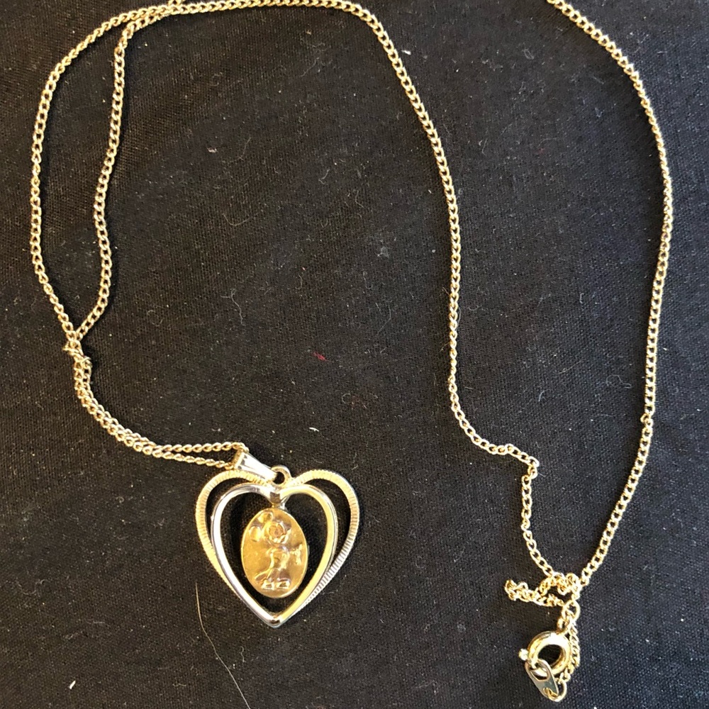 Vintage gold Mickey Mouse in heart pendant.